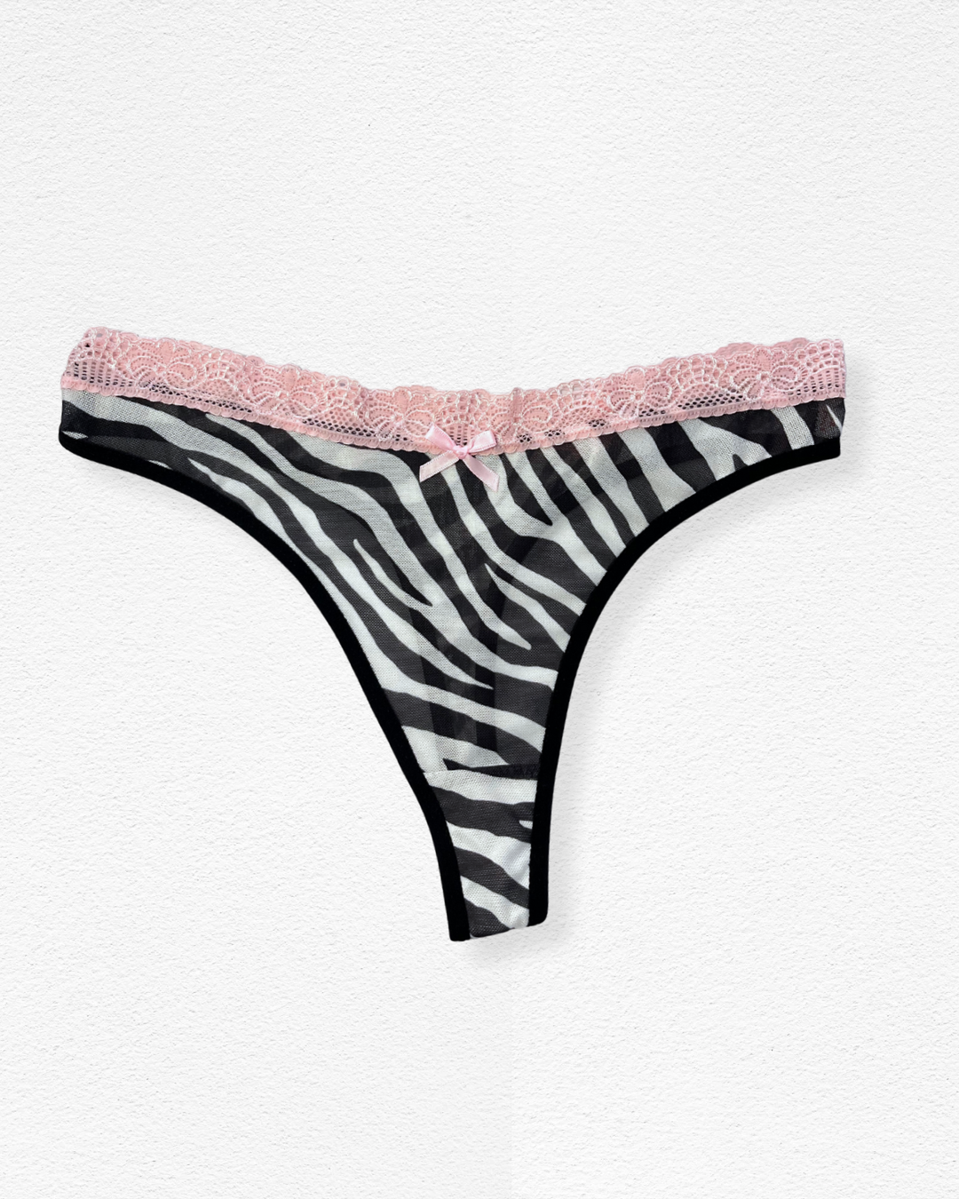 Panty hilo con encaje floral y transparencias